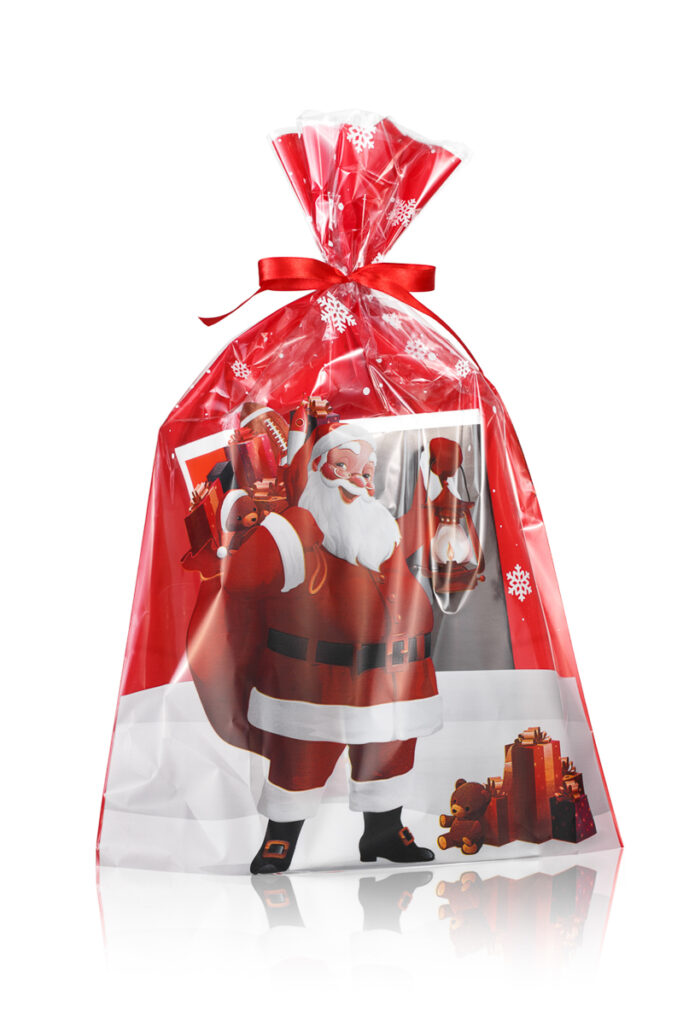 Świąteczna torebka z folii z Mikołajem – czerwony nadruk i wstążka - seria packshotów opakowań świątecznych